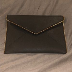 Rebecca Minkoff black Leo Clutch NWT. NEVER WORN